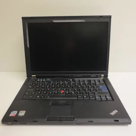Kannettava tietokone Lenovo Think Pad T61, laturi, hiiri ja kantolaukku.