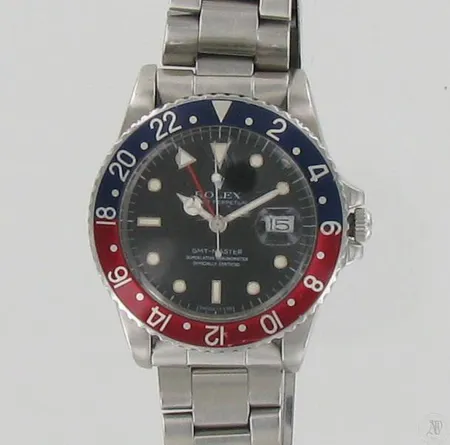 Miesten teräsrannekello Rolex Oyster Perpetual GMT Master, mallinumero 16750, sarjanumero 8479920, taulun Ø 40, hihnan pituus 180mm, aitoustodistus, laatikossa.