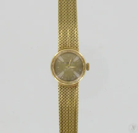 Kultarannekello Eterna-Matic, quartz, kaiverrettu, taulu hieman hapettunut, taulun Ø 18mm, hihnan pituus 170-180mm, 750br, paino 33,7g, paristo loppunut Paino: 33,7 g