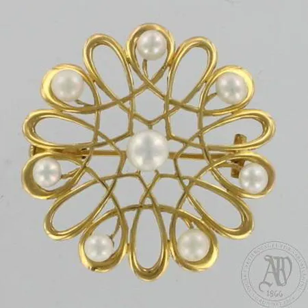 Helmirintaneula, nimileima AT eli A. Tillander, vuodelta 1955, Ø 32mm, 750br, paino 5,7g Paino: 5,7 g