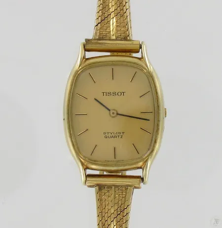 Viallinen kultarannekello Tissot Stylist Quartz, kaiverrettu, ranneke ei kultaa, 585br, 25,2g Paino: 25,2 g