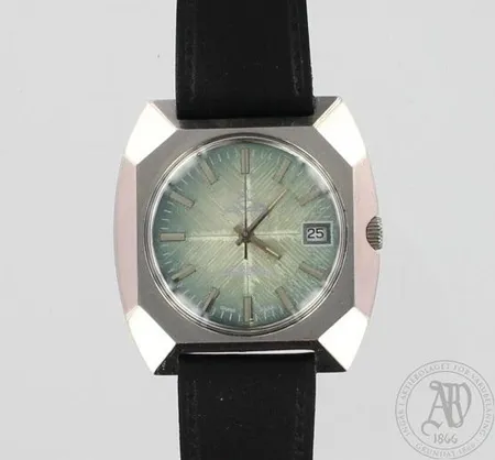 Miesten teräsrannekello Leijona päivyrillä, tekonahkaranneke, mekaaninen 17-kivinen, taulun Ø 38mm