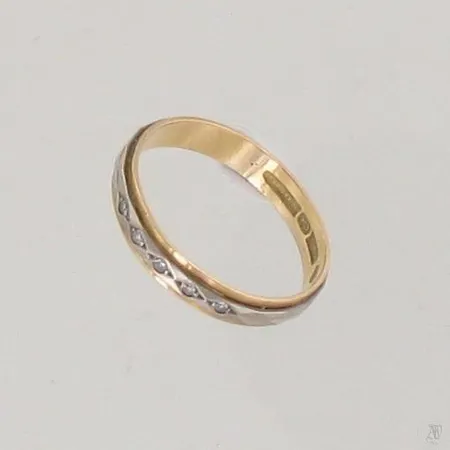 Timanttisormus 5xn.0.005ct, koko 18¼, 750 kelta- ja valkokulta, paino 2,6g Paino: 2,6 g