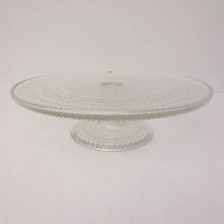 Kakkuvati Iittala Kastehelmi, Ø 31,5cm, kirkas, pieniä naarmuja pinnassa.   Ota yhteys panttilainaamoon kuljetusmaksusta sopimiseksi.