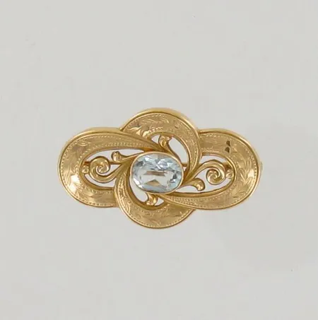 Kivirintakoru, nimileima AT, leveys 40mm, vuodelta 1951, 750br, paino 7,1g