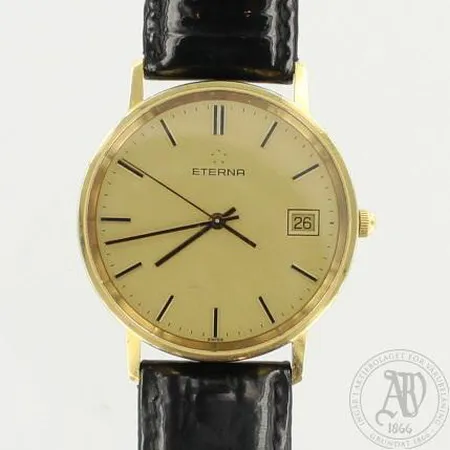 Kultarannekello Eterna, taulun Ø 34mm, quartz, nahkaranneke kulunut, sarjanumero 4100 65, 585br, paino 26,9g paristo loppunut