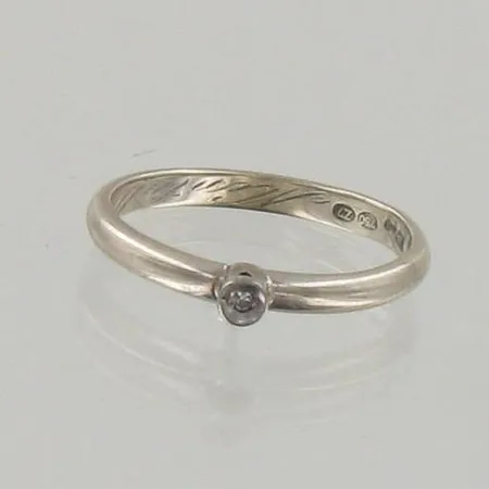 Timanttisormus 1xn.0.005ct, kaiverrettu, koko 16, 750 valkokulta, paino 1,9g