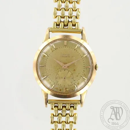 Kultarannekello, Revue Automatic, käytön jälkiä, Ø 34mm ref.137527, pituus 210mm, 750br hihna kultaa, paino 60,0g