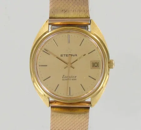 Teräsrannekello Eterna Executive Quartz 4000, kaiverrettu, lasissa naarmuja, taulun Ø 35mm, rannekkeen pituus 170mm