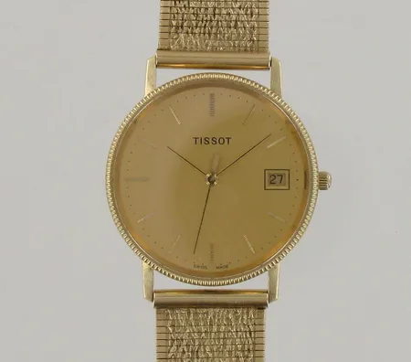 Kultarannekello Tissot quartz, kaiverrettu, hihnan pituus 195-205mm, 585br, paino 60,8g, paristo loppu