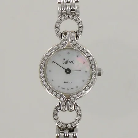 Kultarannekello Corteal timanteilla 65xn0.001ct, yksi timantti tippunut, quartz:paristo loppunut, rannekkeen pituus 165mm, taulun Ø 21mm, 585 valkokulta, paino 26,8g 