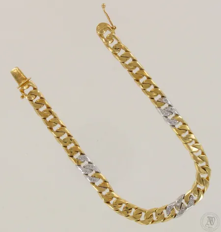 Panssariranneketju timanteilla 12xn.0.01ct, pituus 190mm, kaiverettu, käytön jälkiä, 750 kelta- ja valkokulta, paino 21,8g  