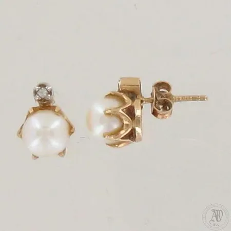 Helmikorvakorut timantilla 2xn.0.005ct, helmen Ø 7mm, toinen tausta metallia, 585br, paino 2,4g