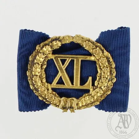 Ansiomerkki, nimileimalla A.T vuodelta 1938, 813br, paino 7,8g