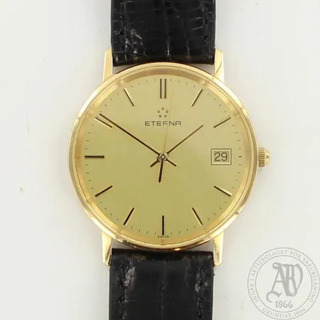 Kultarannekello, Eterna, takakannesta poistettu kaiverrus, Ø 33mm, nahkarannekkeen pituus 190-230mm, paristo loppunut eikä käyntitakeita, 585br, paino 26,9g