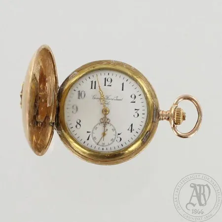 Viallinen kultataskukello, Ø 34mm, välikuori kultaa, 585br, paino 37,5g
