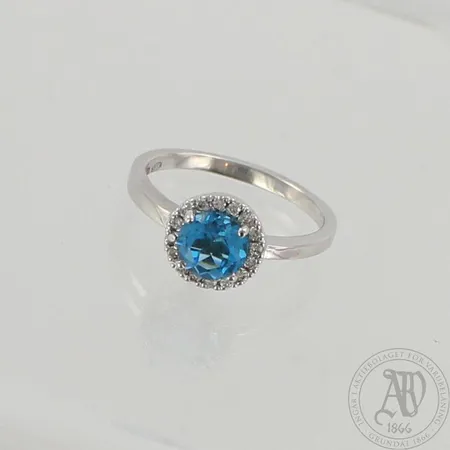 Kivisormus timanteilla 16xn.0.02ct, keskikiven Ø 7mm, koko 19, 585 valkokulta, paino 4,3g