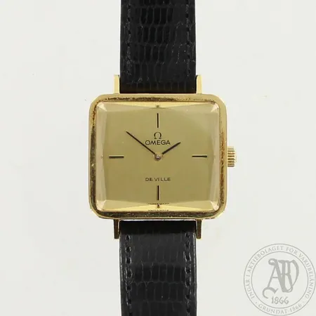 Kultarannekello Omega, De ville, kaiverrettu, manuaali, mitat 23x26mm, nahkaranneke ja Omegan solki, 750br, paino 25,2g 