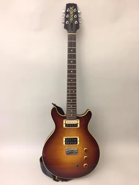 Sähkökitara Hamer Sunburst, sarjanumero 127249, made in USA, käytön jälkiä, ja pehmeä laukku. Ota yhteys panttilainaamoon kuljetusmaksusta sopimiseksi.