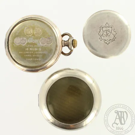 Viallinen taskukello Zenith, kaiverrettu, suojakotelo metallia, 16 kivinen, Ø 52mm, 800br, paino 117,3g  
