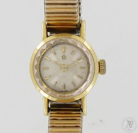 Kultarannekello Eterna, automaatti, taulun Ø18mm, ranneke kullattua metallia, pituus 165mm, 750br, paino 26,3g