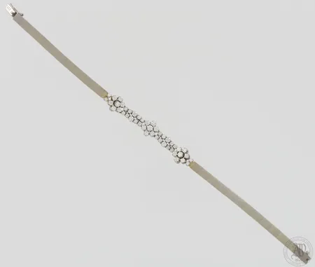 Timanttirannekoru 25xn.0.04ct 20xn.0.02ct, pituus 195mm, leveys 4-10mm, 585 valkokulta, paino 22,8g