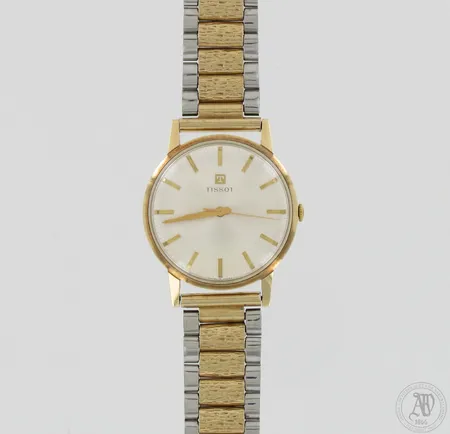 Kultarannekello Tissot, mekaaninen, taulun Ø 34mm, takakannessa kaiverrus, pieniä käytön jälkiä, ranneke kullattua metallia, pituus 195-210mm, 585br, paino 56,2g