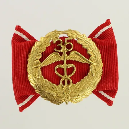Keskuskauppakamarin ansiomerkki 35 vuotta, korkeus 35mm, leveys 49mm, 830br, paino 7,5g