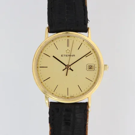 Kultarannekello, Eterna, taulun Ø 32mm, quartz:ei käy, kaiverrettu, kulunut nahkaranneke, rasia, 750br, paino 29,3g Lähetetään postipakettina.