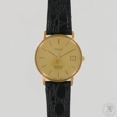 Kultarannekello, Tisso Seastar, kaiverrettu, lasissa naarmuja, quartz patteri loppunut, nahkaranneke pituus 210mm, taulun Ø33mm, 585br