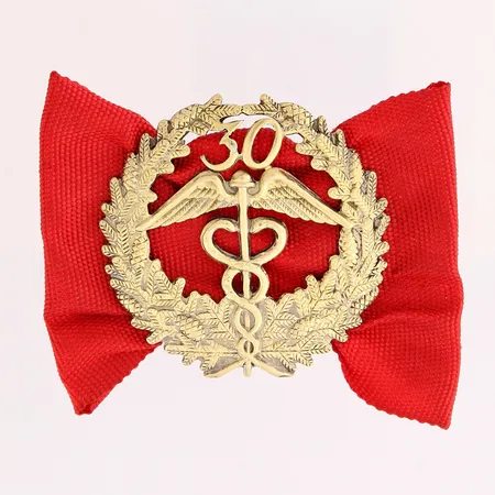 Keskuskauppakamarin ansiomerkki 30 vuotta, korkeus 34mm, leveys 49mm, 830br Paino: 7,1 g