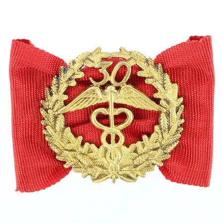 Keskuskauppakamarin ansiomerkki 30 vuotta, korkeus 34mm, leveys 49mm, 830br  Paino: 8,8 g