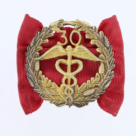 Rintamerkki, korkeus 32mm, 813br,  Paino: 7,1 g