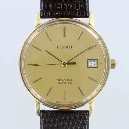 Kultarannekello Tissot Seastar, quartz, kaiverrettu, patteri loppunut, rungon Ø33,5mm, nahkarannekkeen pituus 170-205mm, ranneke viallinen, ranneke ei alkuperäinen, 585br Paino: 0 g