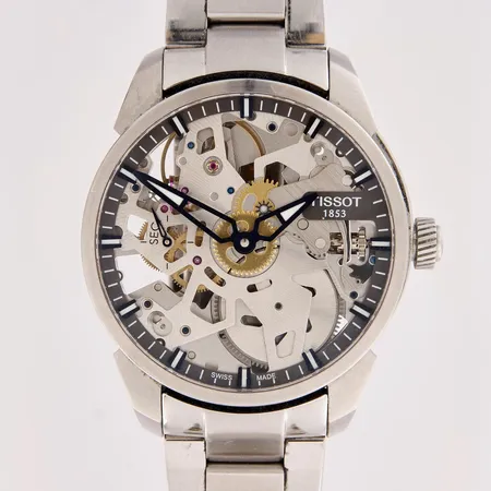 Teräsrannekello, Tissot, T-Complication Squelette, ref. T070405 A, mekaaninen, rungon Ø 44mm, pieniä käytön jälkiä, mukana laatikko, jatkopala ja nahkaranneke