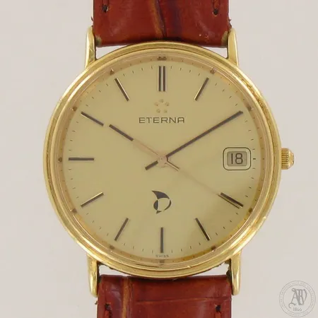 Kultarannekello Eterna nahkarannekkeella, Ø 35mm, pituus 170-210mm, kaiverrettu ja logo-painatus kellotaulussa, ei patteria, 750br,   Paino: 32,7 g