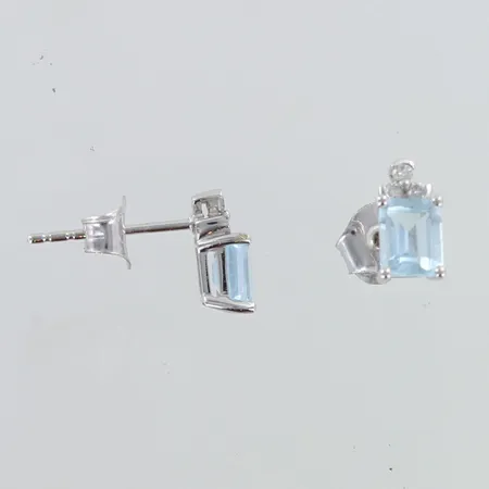 Timanttikorvakorut topaaseilla 6xn.0.01ct, korkeus 9mm, 585br valkokulta, E.Lindroos todistus,   Paino: 1,2 g