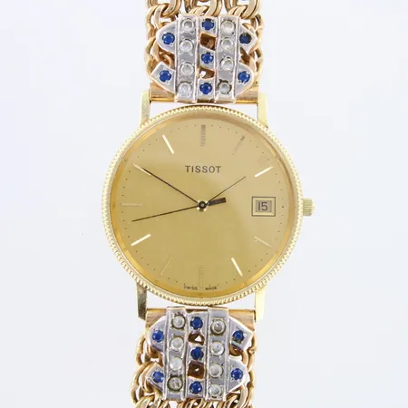 Kultarannekello Tissot, Swiss made, quartz, kaiverrettu, paristo loppunut, käytön jälkiä, lasissa naarmu, rungon Ø33,5mm, kultaranneke kivillä, kultarannekkeen pituus 210mm,  585br,  Paino: 84,8 g