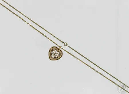 Kaulakoru, pituus 71cm, leveys 2mm, korkeus 35mm, Utajärven sydän, Kalevala Koru, pronssia.