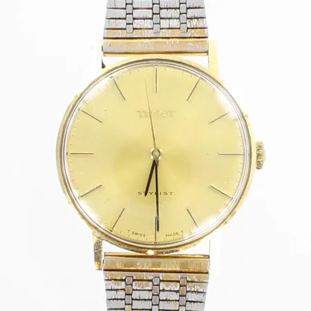 Kultarannekello, Tissot Stylist, kaiverrettu, mekaaninen, lasissa kulumia, taulun Ø 33mm, ranneke metallia, 585br, 