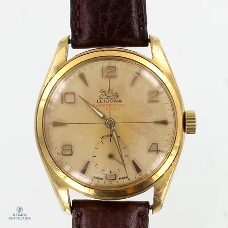 Teräsrannekello Leijona, Super Extra, 17 kivinen, mekaaninen, taulussa hapettumaa, taulun Ø 36mm, rungossa kulumaa ja muovilasissa käytön jälkiä, nahkaranneke