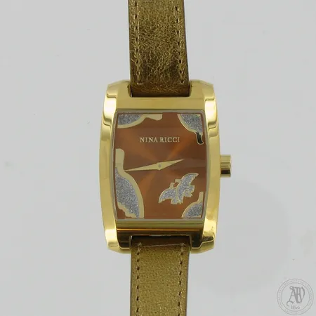 Teräsrannekello Nina Ricci nahkarannekkeella, quartz, korkeus 40mm, leveys 30mm, pituus 160-180mm, ei patteria, säilytysrasia.   
