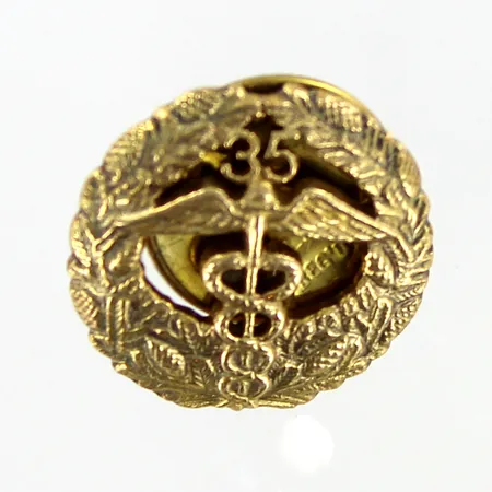 Keskuskauppakamarin pinssi 35 vuotta, Ø 16mm, 830br Paino: 2,2 g