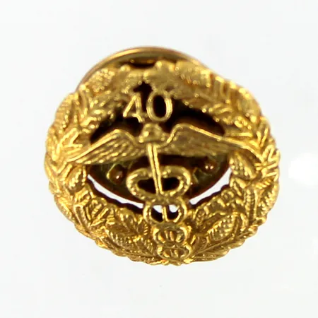 Keskuskauppakamarin pinssi 40 vuotta, Ø 16mm, 830br Paino: 2,3 g