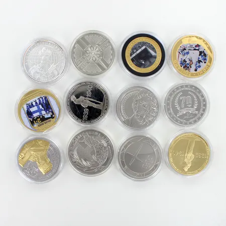 12 keräilymitalia, kuperi nikkeliä 