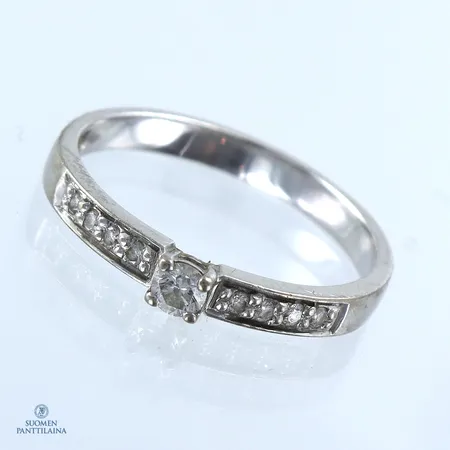 Timanttisormus 1x0.07ct ja 8xn.0.005ct, koko 16½, 585 valkokulta,  Paino: 1,9 g