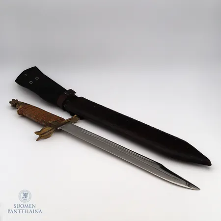 Taisteluveitsi nahkatupessa, terän pituus 31cm, leijonanpää, 