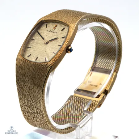 Kultarannekello Corum, 27156 104484, manuaalinen, rannekkeen pituus 190mm, taulun leveys 25mm, kaiverrettu, 750br,  Paino: 91,3 g