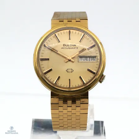 Viallinen kultarannekello Bulova AccuQuartz, 3 901391, quartz, rannekkeen pituus 190mm, taulun Ø 35mm, kaiverrettu, 750br,  Paino: 91,3 g