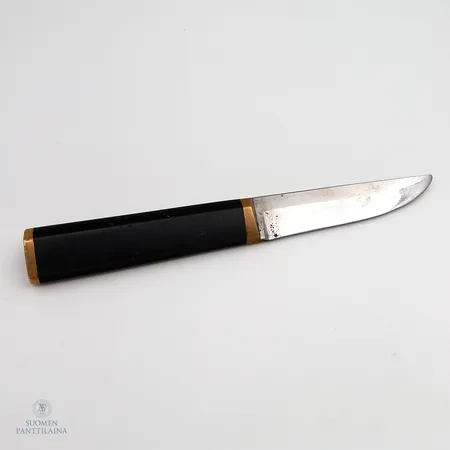 Puukko, pituus 210mm, Hackman - Tapio Wirkkala, ruostumatonta terästä, nailonia ja messinkiä, käytön jälkiä terässä ja kahvassa, Malli suunniteltu 1961 Paino: 0 g